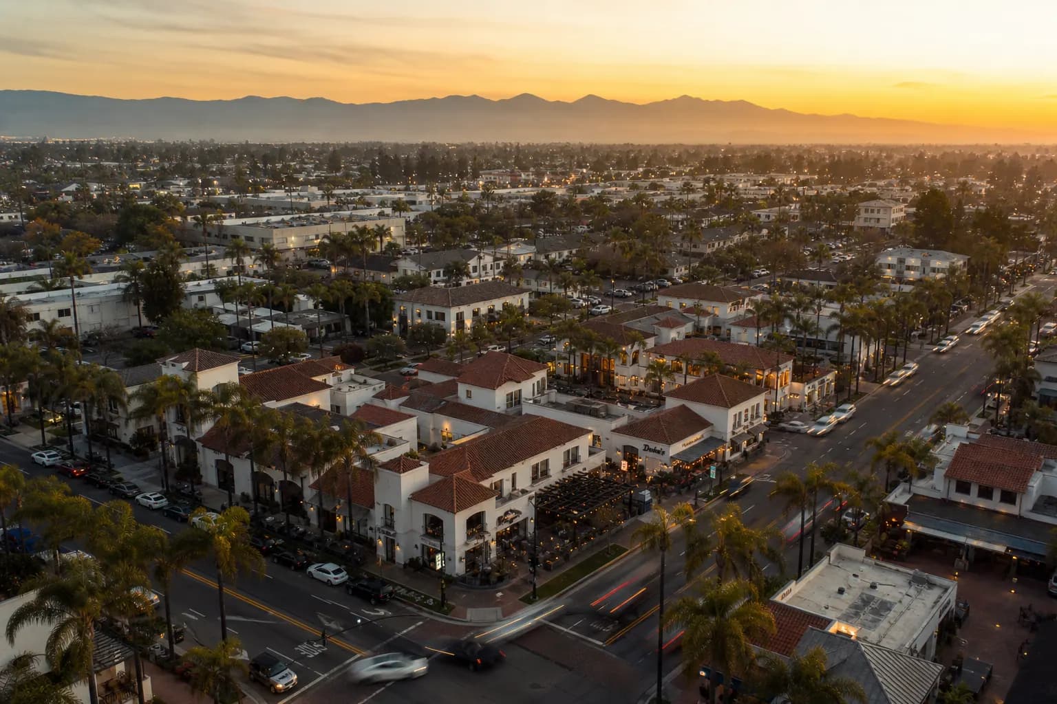 Aerial view of Huntington Beach restaurant district at golden hour